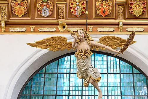 Germany, Mecklenburg-Vorpommern, Stralsund. St. Marys Churche. Figure of angel blowing trumpet. European Print
